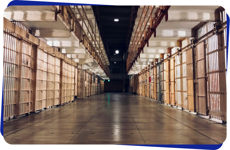 A long hallway in a prison cell.