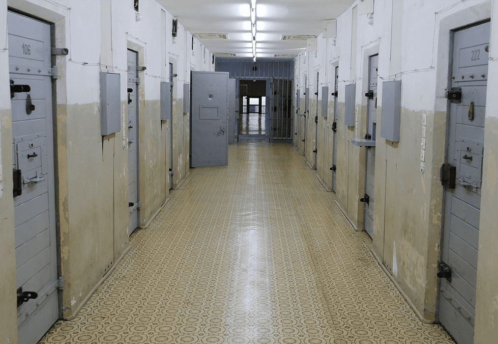 A long hallway in a prison.