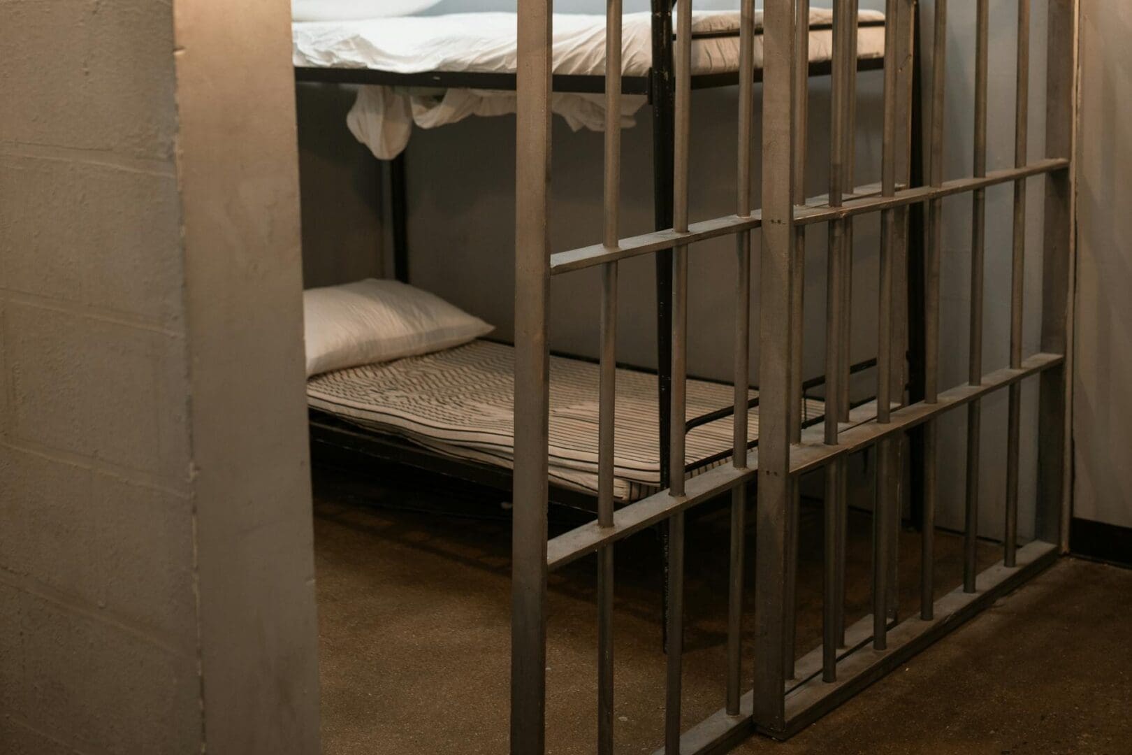 A bed in a prison cell.